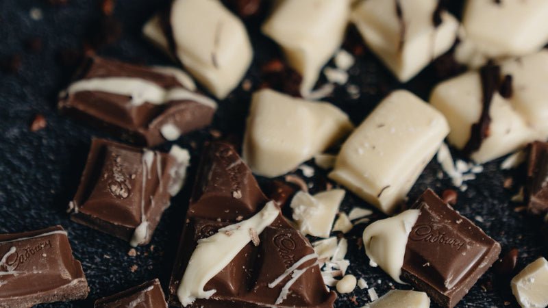 Dark chocolate squares next to gummies
